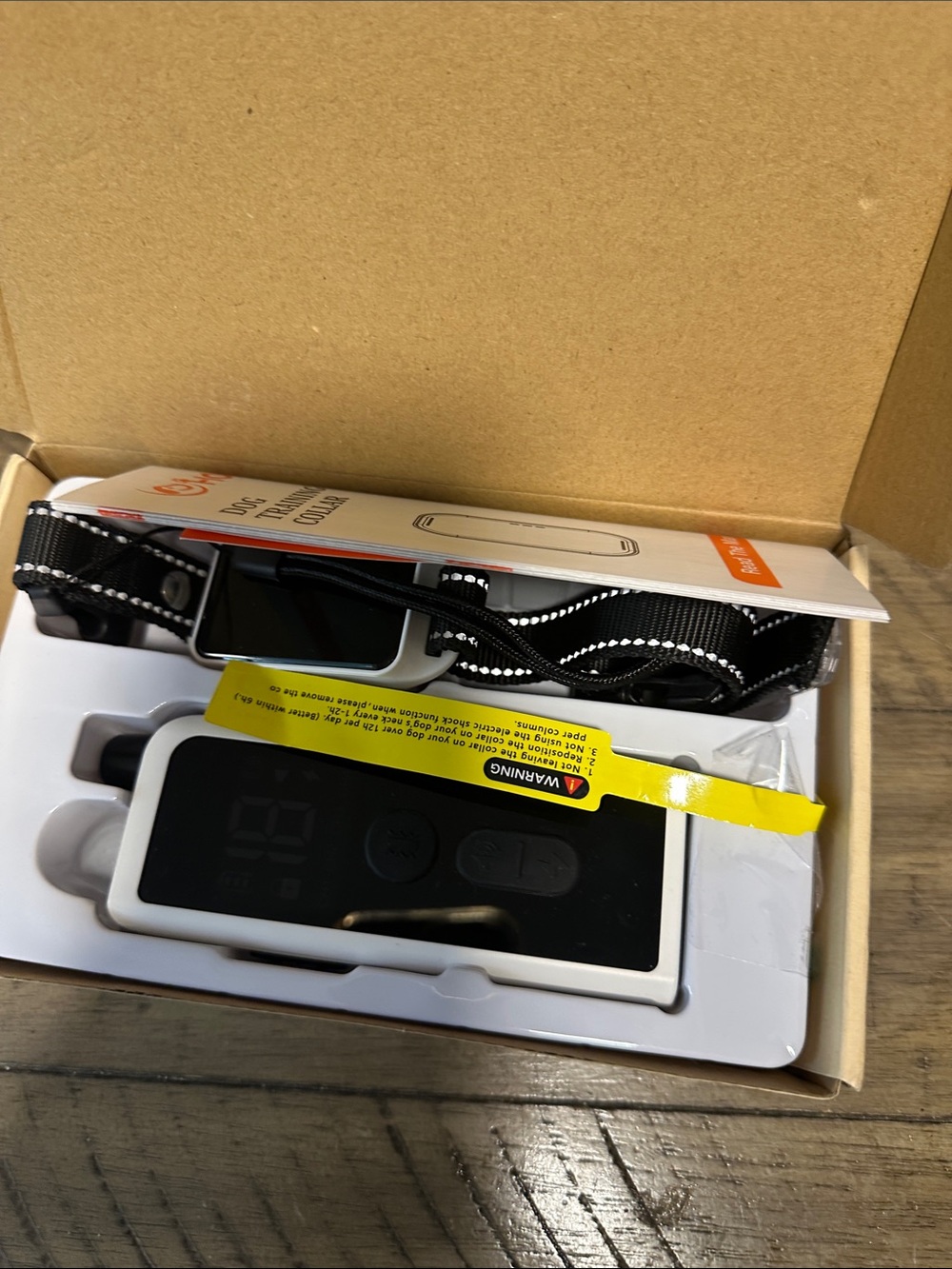 White Body-Mounted Camera Remote with Adjustable Black Strap